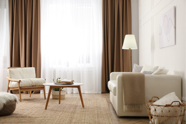 Living room with neutral colors and matching cream carpet