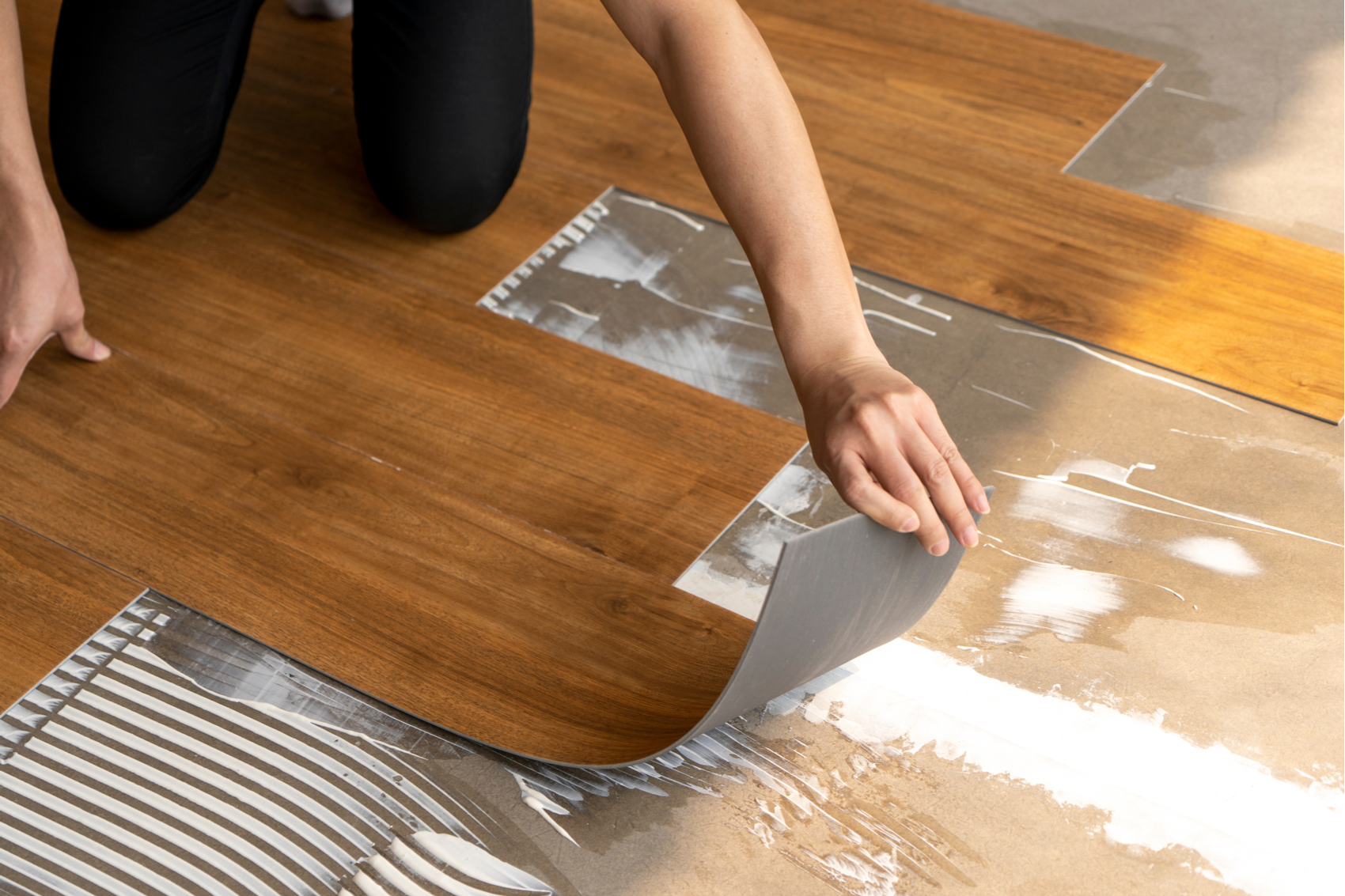 Professional installing luxury vinyl planks