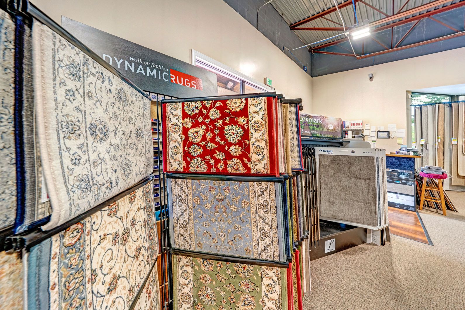 Dynamic fashion rugs display. The rugs on the display have floral designs