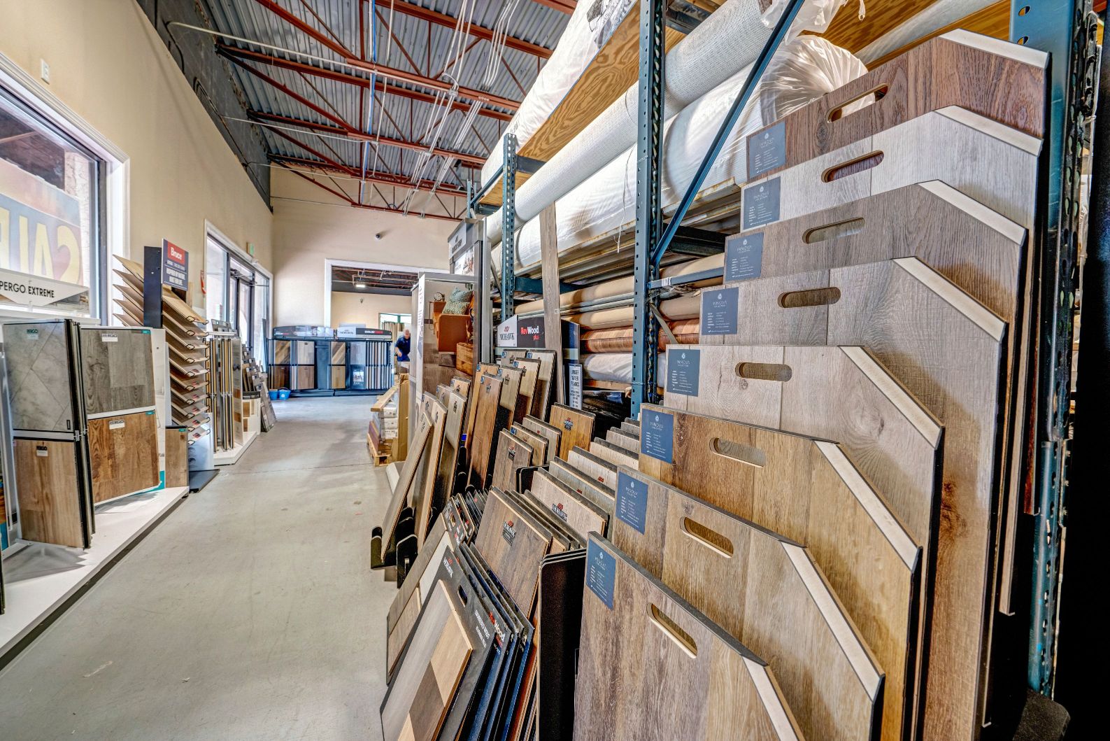 Long aisle full of flooring samples in a showroom